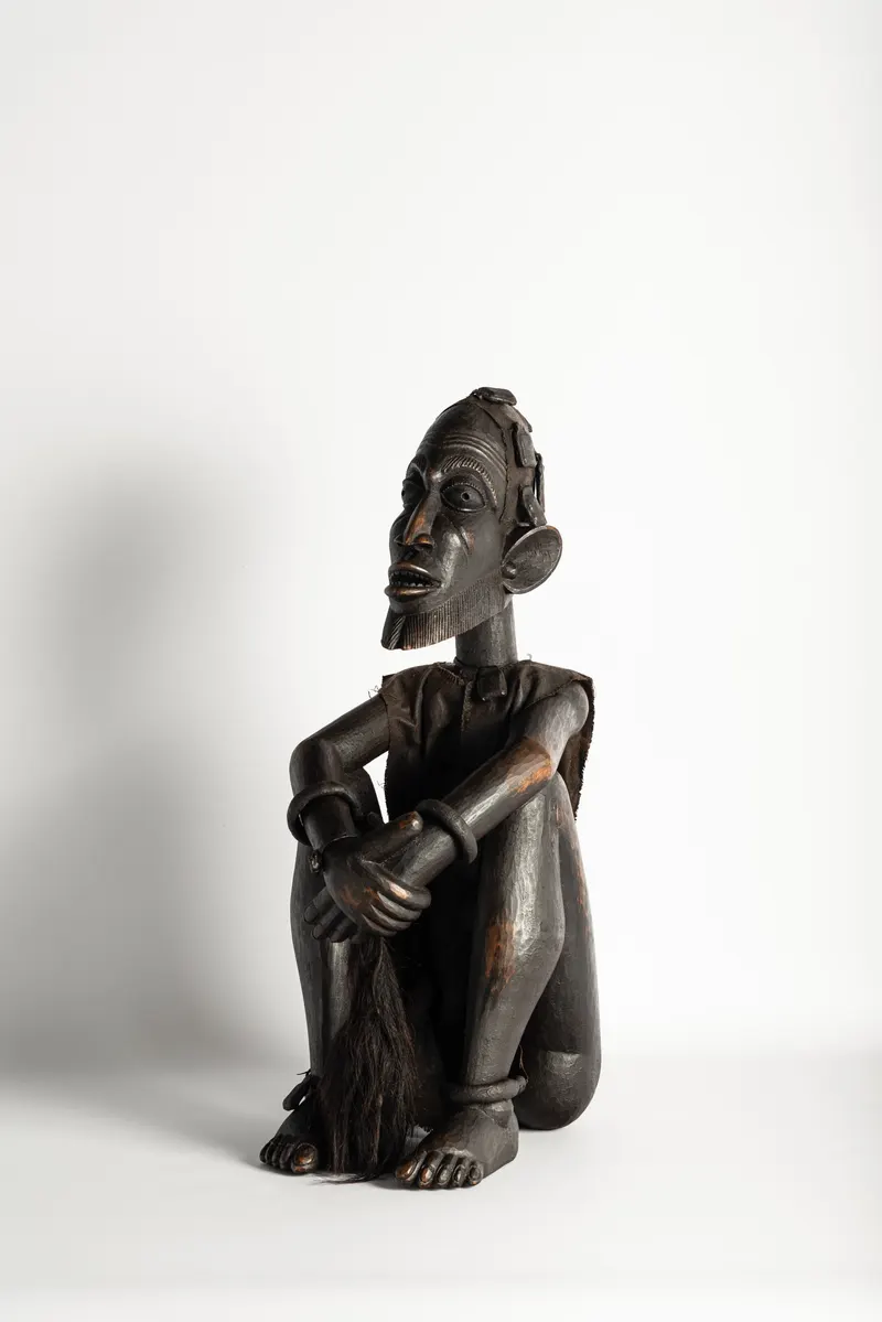 Dogon Seated Figure with Protective Amulets
